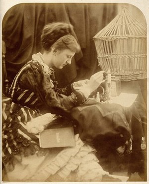 view May Prinsep reading a letter. Photograph by Julia Margaret Cameron, 1870.