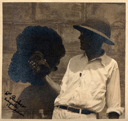 Marshall Albert Barber (Rockefeller Foundation) holding a fungus. Photograph.