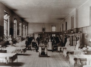view Baron Lister (seated) with his staff, Victoria ward, King's College Hospital, Lincoln's Inn Fields. Photograph, 1893.