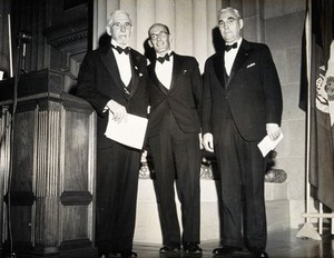 view Three scientists at the Washington Congress of Tropical Medicine. Photograph, 1948.