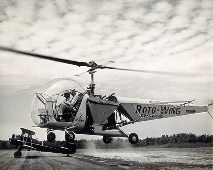 Sir Gordan Covell in a helicopter, Beltsville, Maryland. Photograph, 1948.