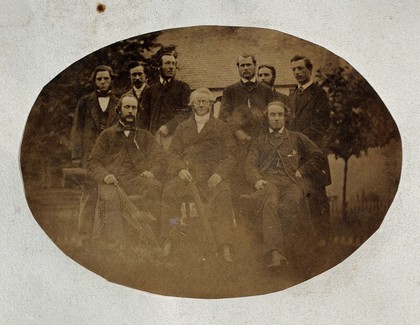 Milnholm (?) Asylum: nine members of staff. Photograph, July 1862.