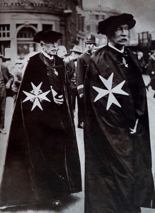 HRH Prince Arthur, Duke of Connaught, right, wearing the robes of Grand Prior (or other high grade) of the order of Saint John. Photograph.
