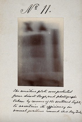 Light emitted by Röntgen Ray Tubes: blurred letters and shapes. Photoprint from radiograph, by James Wimshurst, 1898.