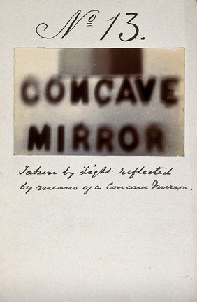 Light emitted by Röntgen Ray Tubes, reflected using a concave mirror: the word "concave mirror". Photoprint from radiograph, by James Wimshurst, 1898.