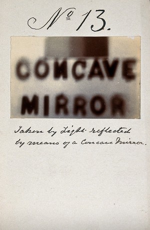 view Light emitted by Röntgen Ray Tubes, reflected using a concave mirror: the word "concave mirror". Photoprint from radiograph, by James Wimshurst, 1898.