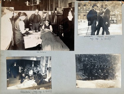 St Bartholomew's Hospital, London: doctors seeing to a sick man. Photograph, c. 1908.
