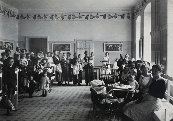 University Children's Hospital, Vienna: patients waiting in a seated area in the out-patients' department. Photograph, 1921.