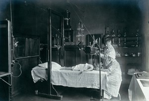view University Children's Hospital, Vienna: a child having an x-ray. Photograph, 1921.