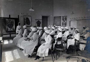 view University Children's Hospital, Vienna: nurses taking notes in a classroom. Photograph, 1921.