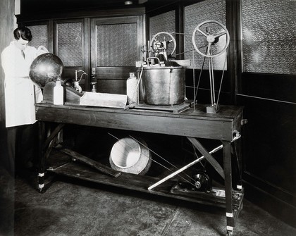 Philadelphia College of Pharmacy and Science: experimenting with the coating on tablets. Photograph, c. 1933.