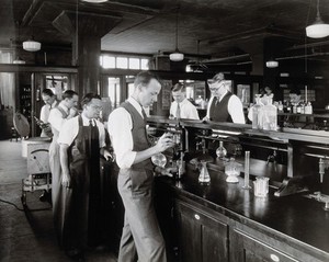 view Philadelphia College of Pharmacy and Science: students in a laboratory. Photograph, c. 1933.