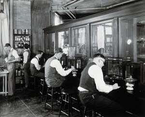 view Philadelphia College of Pharmacy and Science: students in a laboratory. Photograph, c. 1933.