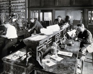 view Philadelphia College of Pharmacy and Science: students experimenting with plants in a laboratory. Photograph, c. 1933.