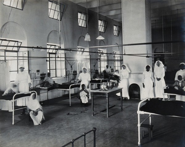 Lady Hardinge Medical College and Hospital, Delhi: nurses on a ward. Photograph, 1921.
