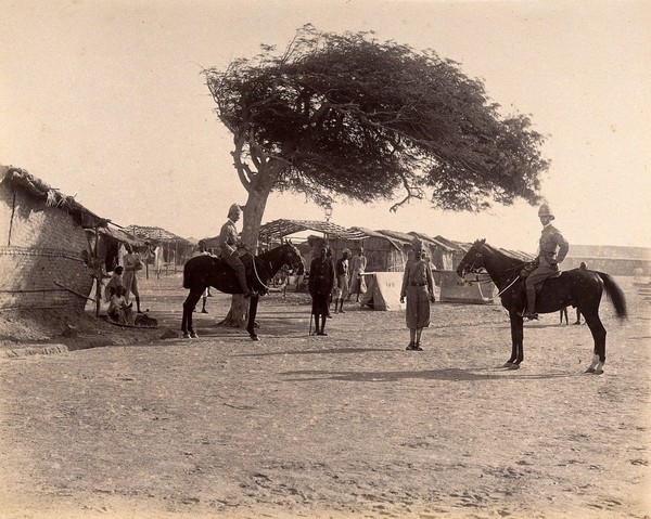 Officers on horseback in the Nusserpuri camp, set up as part of the Karachi Plague Committee, India. Photograph, 1897.