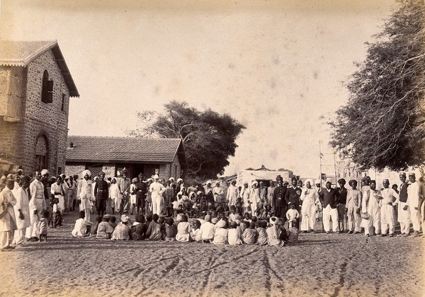 Staff of the Karachi plague committee in the town of Dhobi Ghat, during bubonic plague outbreak, Karachi, India. Photograph, 1897.