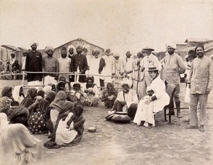 view Patients being given soup, during the bubonic plague outbreak in Karachi, India. Photograph, 1897.