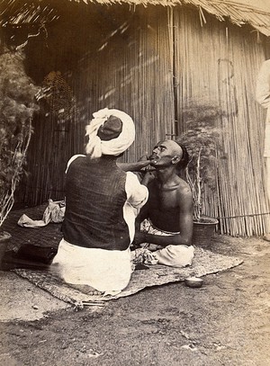 view Man being shaved in one of the hospital camps, during the outbreak of bubonic plague in Karachi, India. Photograph, 1897.