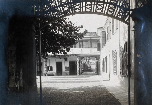 British Red Cross Hospital, Turin: passage leading to a courtyard. Photograph, c. 1918.