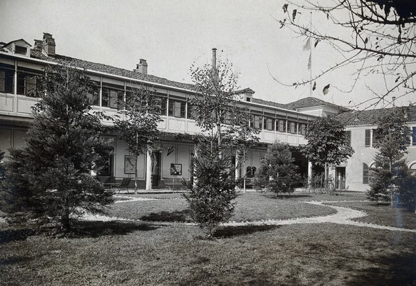 British Red Cross Hospital, Turin: buildings and lawn. Photograph, c. 1918.