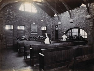 view Johannesburg Hospital, South Africa: outpatients department with drugs dispensary counter on the right. Photograph, c. 1905.