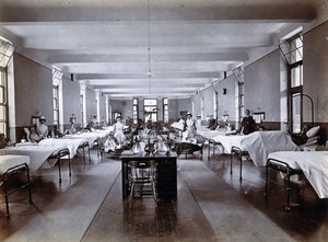 view Johannesburg Hospital, South Africa: hospital ward with child patients and nurses. Photograph, c. 1905.