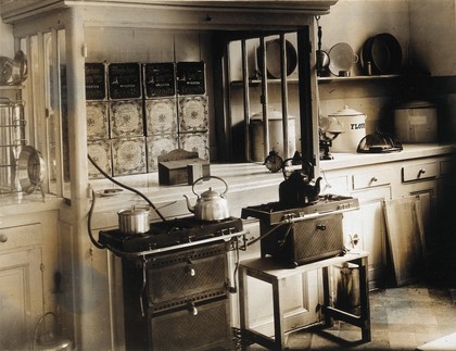 Military Hospital V.R. 76, Ris-Orangis, France: kitchen area, with stoves and kettles. Photograph, 1916.