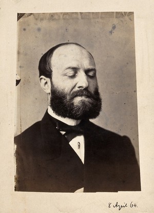 view A bearded man, head and shoulders, with his eyes closed. Photograph by L. Haase after H.W. Berend, 1864.