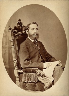 Arthur Schuster, seated, facing left, aged about 38. Photograph by L. Suscipi, c. 1888.