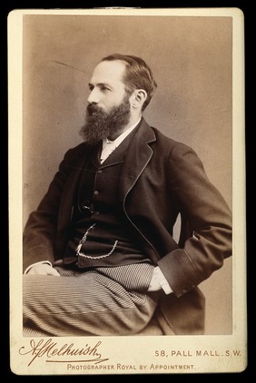 Arthur Schuster, seated, facing right, aged about 45. Photograph by A.J. Melhuish, c. 1896.