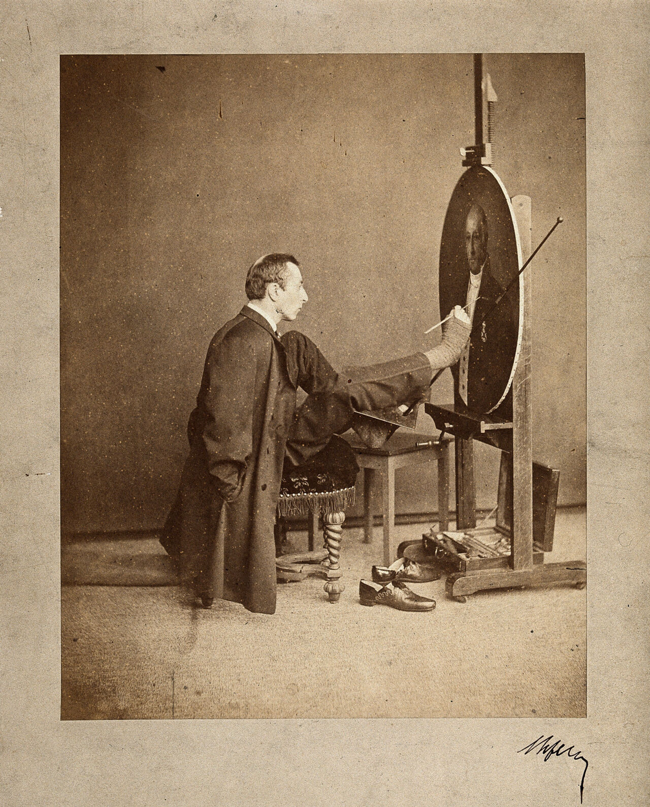 A man painting an oval portrait using his feet. Photograph by J. Dupont, c. 1870., by Joseph Dupont