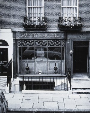view Savory & Moore Ltd, London: the window and front door of the pharmacy. Photograph.