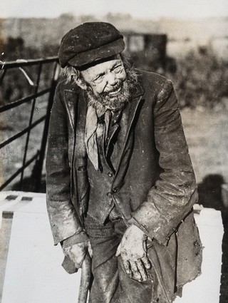A man dressed in shabby clothes who claimed to be 126 years old. Photograph, c. 1926.