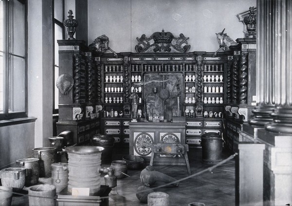 The interior of an old pharmacy reproduced in the National Museum, Prague. Photograph by Z. Reach.