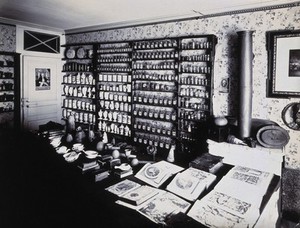 view Part of the collection of pharmaceutical and medical antiques collected by Burkhard Reber and exhibited in Geneva in 1904. Photograph.