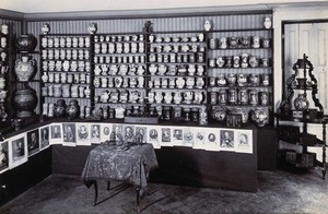 view Part of the collection of pharmaceutical and medical antiques collected by Burkhard Reber and exhibited in Geneva in 1904. Photograph.