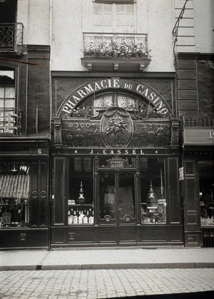 view The front of the pharmacy of J. Cassel, founded in 1683 at 4 Rue de la Barre, Dieppe. Photograph.