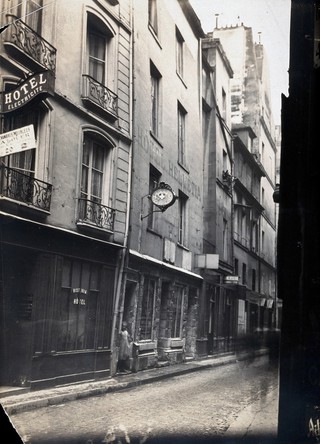 A street in Paris, along which is the Hotel Helvétia, previously the home of Nicolas Flamel, the fourteenth-century alchemist. Photograph.