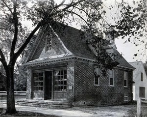 view The exterior of a small brick building used as an apothecary shop by Dr. Archibald Blair in the eighteenth century, Virginia. Photograph.