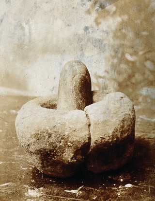 An ancient pestle and mortar found in Aix-les-Bains. Photograph.