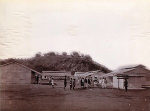 view A plague patient who has just been discharged from hospital being examined outdoors in Bombay. Photograph, 1896/1897.