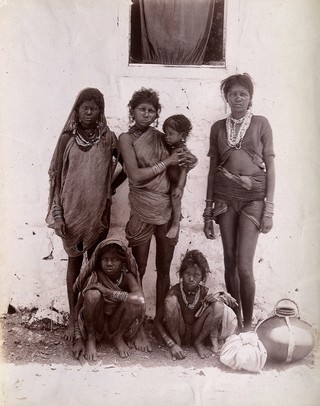 A group of women and children wearing decorated rings in their noses: Bombay at the time of the plague. Photograph, 1896/1897.