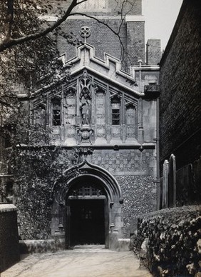 The church of St. Bartholomew the Great; exterior view showing the entrance through the west porch. Photograph by Rev. C.F. Fison.