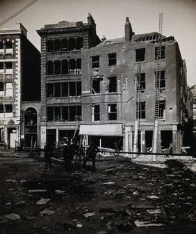 The church of St. Bartholomew the Great and the surrounding area, Bartholomew Close after the Zeppelin air raid on 8 September 1915. Photograph.