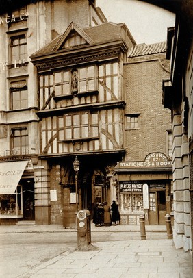 The church of St. Bartholomew the Great and surrounding area; the entrance to the church at West Smithfield. Photograph by Rev. C.F. Fison.