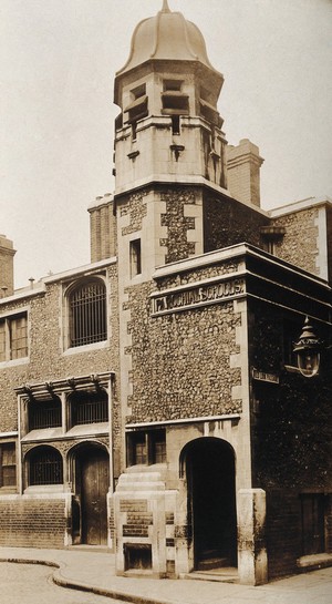 view The church of St. Bartholomew the Great and surrounding area; exterior view of the schools rebuilt in 1889. Photograph by Rev. C.F. Fison.