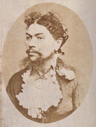 A woman with a moustache and beard: head and shoulders. Photograph.
