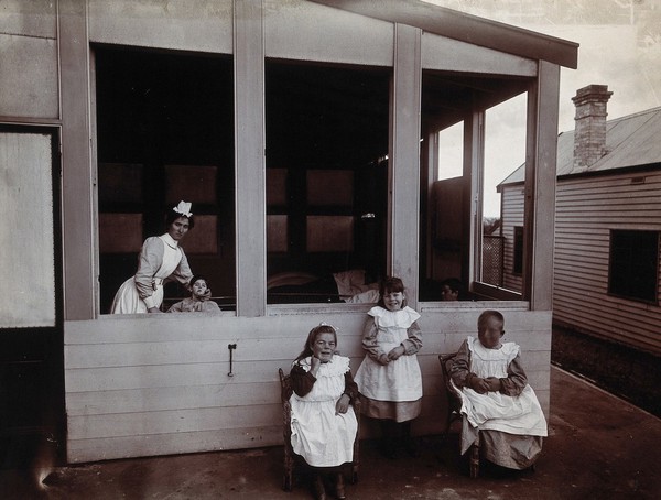Metropolitan Lunatic Asylum, Kew, Victoria (Australia): children with their nurse in the summer house. Photograph.