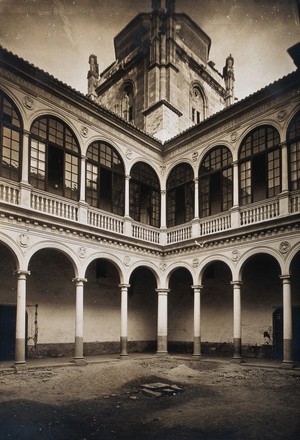 view Lunatic asylum (once a convent), Granada: a corner of the cloister. Photograph, ca.1900.